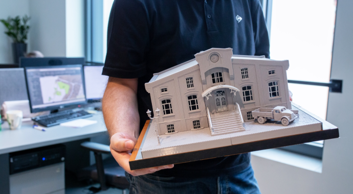 man holding the 3d architectural model