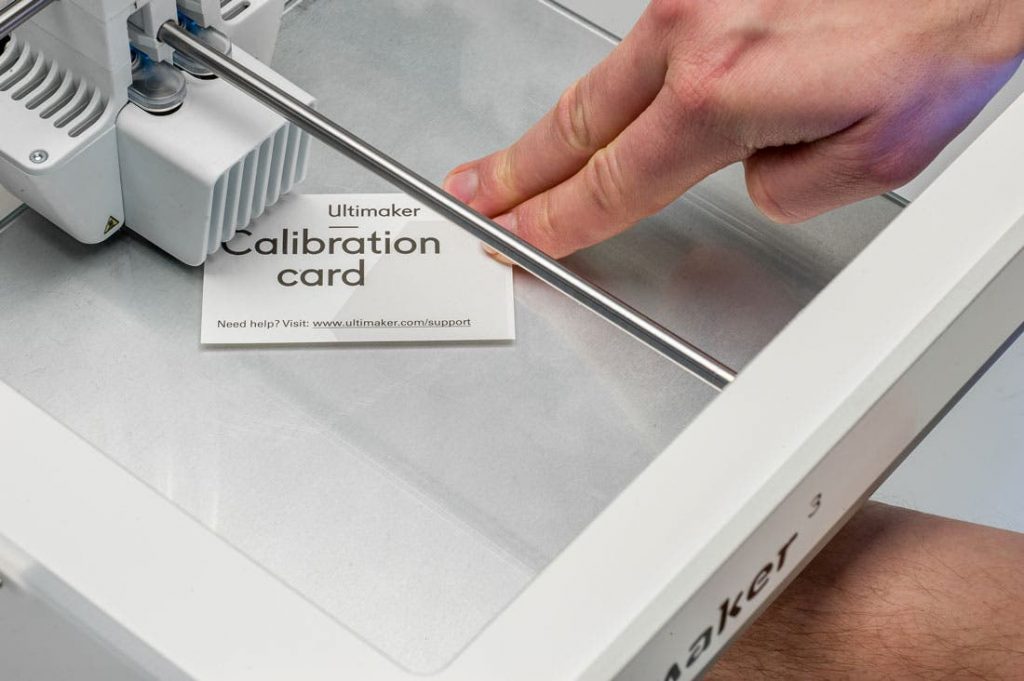 Bed levelling taking place using an Ultimaker calibration card