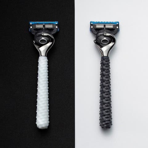a black and a white 3d printed shaver handle for gillette by formlabs