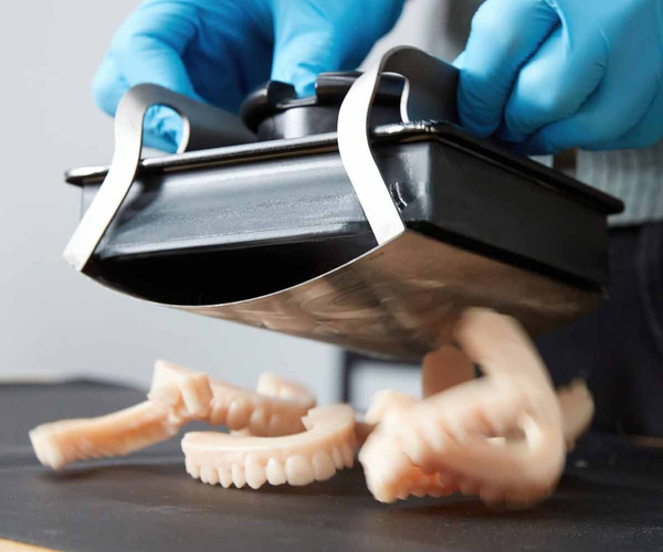 Formlabs build platform with 3D printed dentition leaving the platform effortlessly