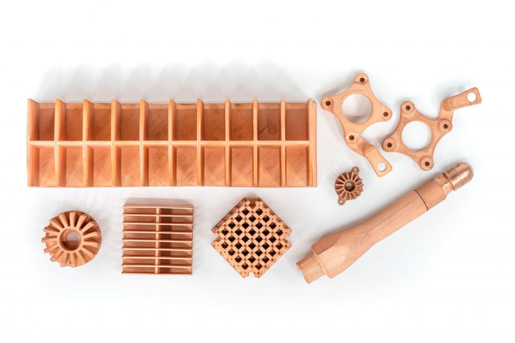 a set of 3d printed parts in markforged copper