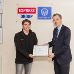 Julian Smith presenting Sam Carr with his certificate