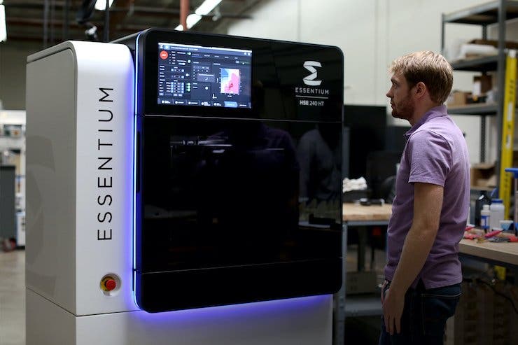 A man inspecting an Essentium HSE 3d printer