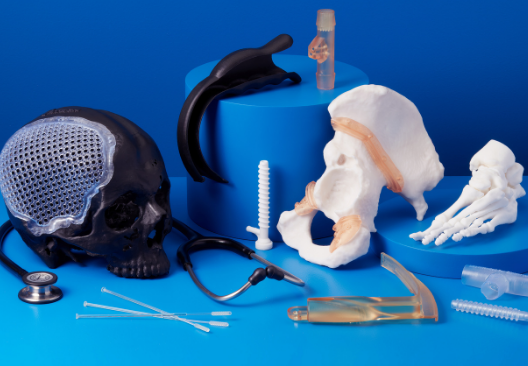 An assortment of prints in biomedical resin - from a skull to a hip to a foot with anatomical detail.