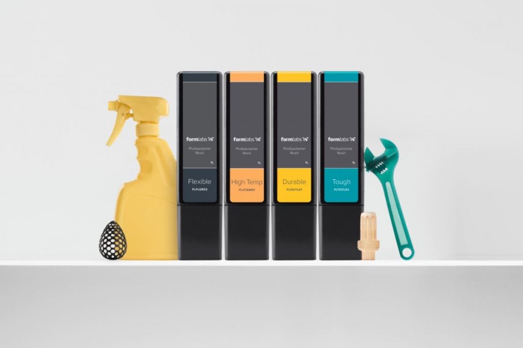 a 3d printed bottle, wrench, and set of formlabs resin cartridges: flexible, high temp, durable, rough