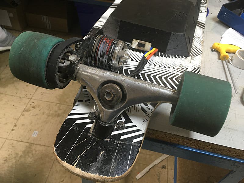 the underside of the motorised skateboard showing the 3d printed housing