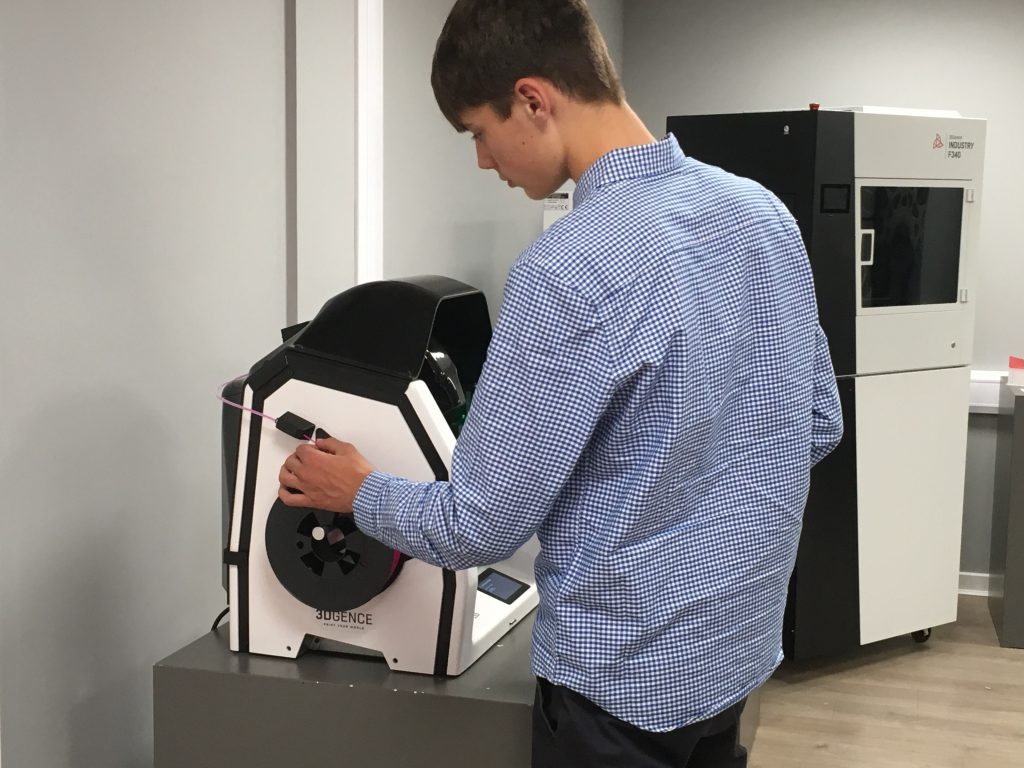 a student using a 3dgence 3d printer