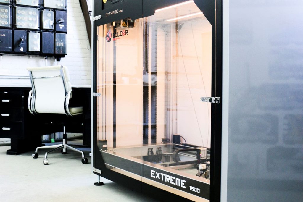 a large builder Extreme 1500 PRO 3d printer stood in a workshop