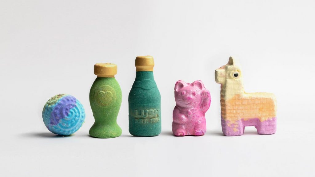 3d printed bath bombs in various designs including a bottle, a cat, and a llama