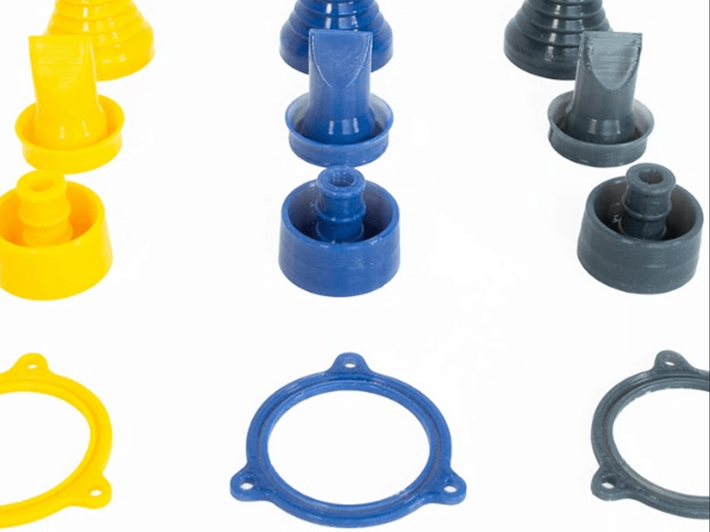 an assortment of lynxter-3d-printed parts in various colours: yellow, blue, grey