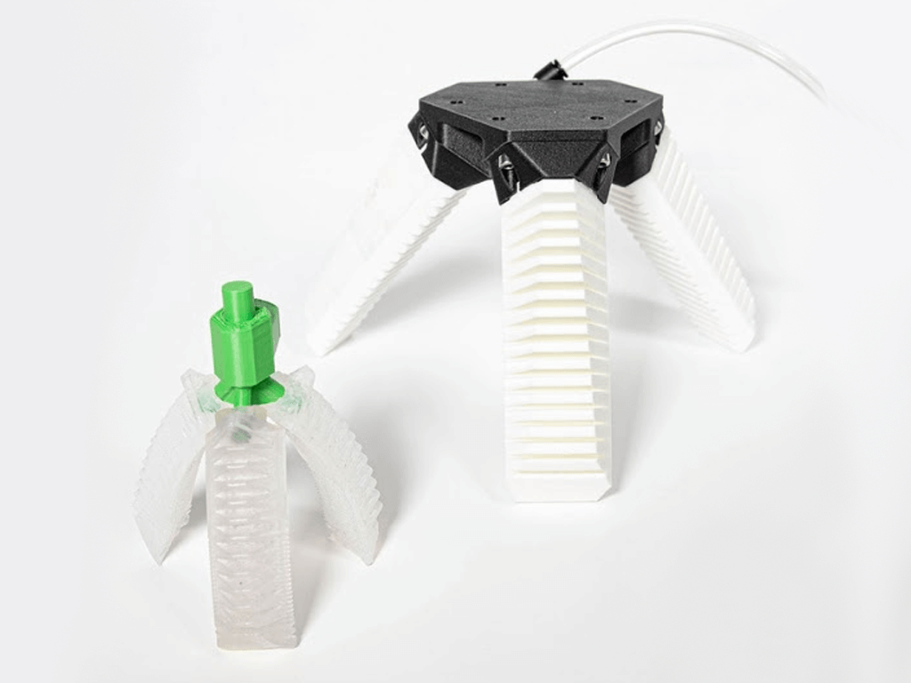 a pair of 3d printed lynxter parts, looking like grippers