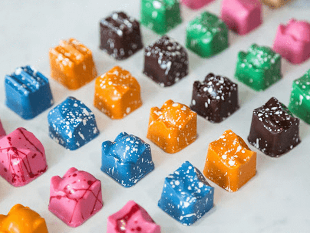 a set of chocolate confectionary in multiple colours created with mayku moulds