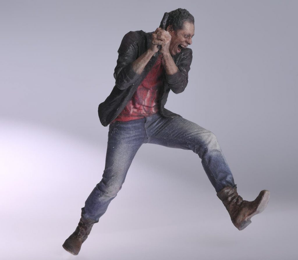 a 3d printed model of a crazy man with a gun, made with selective deposition lamination