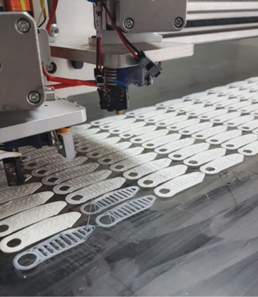 a 3d printer creating a huge amount of tags