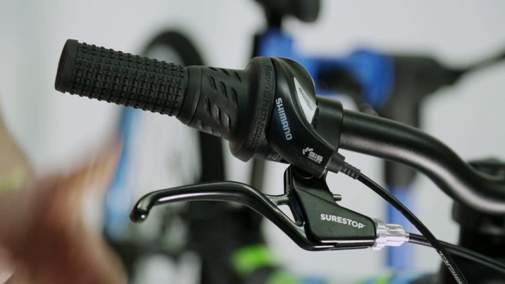 close up photo of a bicycle brake lever and handle, showing the 3d printed surestop braking system