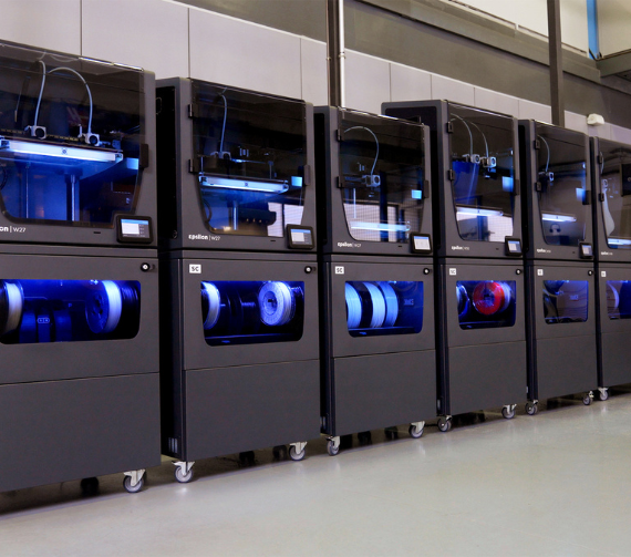 A row of large Epsilon W27 3D printers