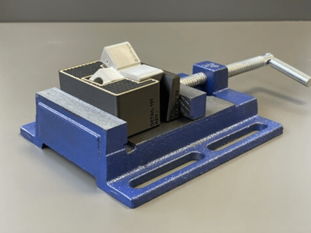 a 3d printed component in a vice