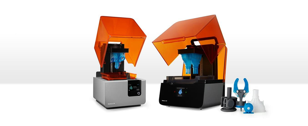 Two desktop sized Formlabs 3D printers.