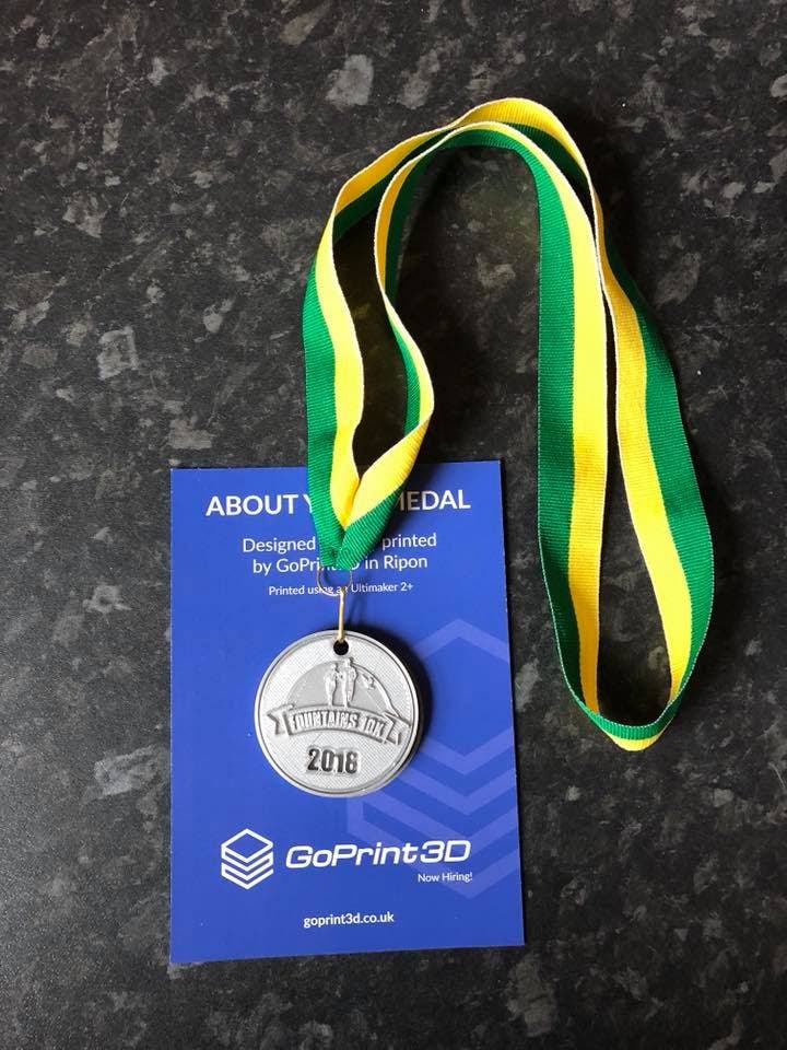 a medal for the fountains abbey 10k, 3d printed by additive x