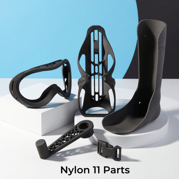 a set of 3d printed parts in nylon 11, including skiing goggles and a bicycle crank shaft