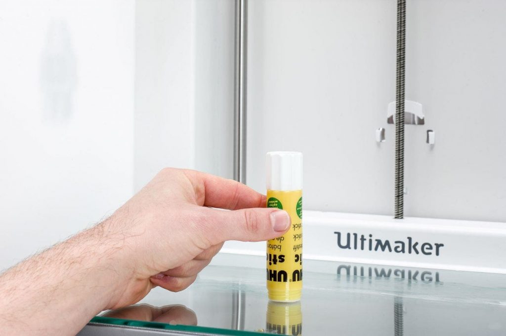 Bed adhesion being increased by someone applying a UHU glue stick to the build plate
