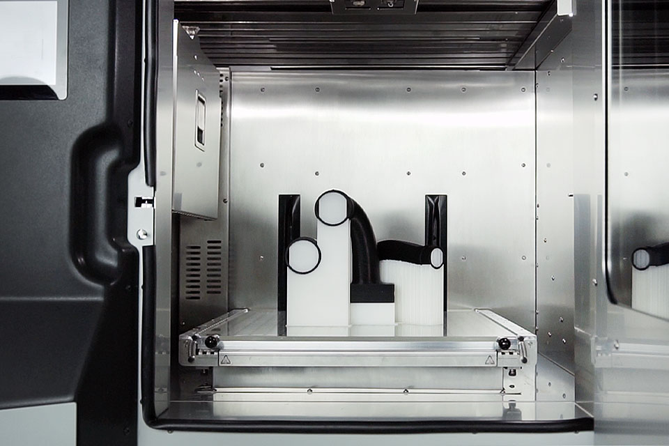 A 3DGence printer producing a part.