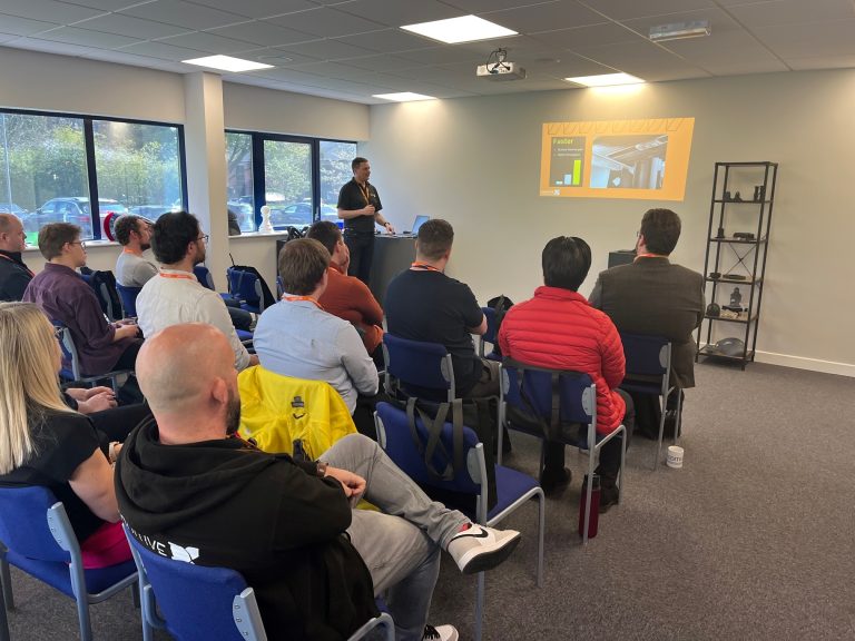 A speech/talk being given my an Additive-X staff member to interested guests.